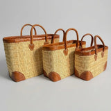 Reed basket with leather trim