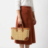 Reed basket with leather trim