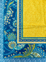 Blue and yellow patterned fabric with floral designs