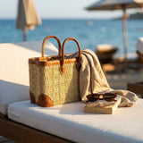 Reed basket with leather trim